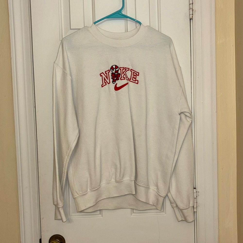 White Christmas Nike logo candy cane pullover